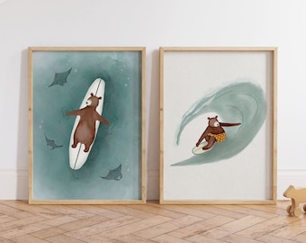 May include: Two framed illustrations of a brown bear surfing on a white surfboard. The first illustration shows the bear lying on the surfboard with three stingrays swimming around it. The second illustration shows the bear riding a wave on the surfboard.