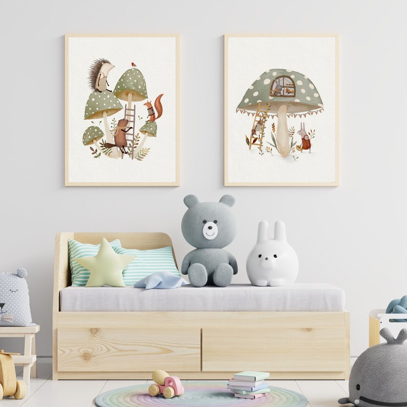 May include: Two framed illustrations of woodland creatures in a mushroom forest. The first illustration shows a hedgehog, squirrel, and a beaver climbing a ladder. The second illustration shows a rabbit and a deer looking at a mushroom house.