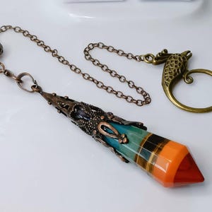 7 Chakra Layered Crystal Pendulum with Phoenix Ring | Powerful tool Dowsing for Divination | Energy Healing | Chakra Alignment Manifestation