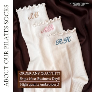 May include: White Pilates socks with ruffled tops, each embroidered with initials in different colors: gold, pink, and blue. The text "ABOUT OUR PILATES SOCKS" is on the left. The text "CUSTOMS AVAILABLE! MESSAGE US!!" is at the top.