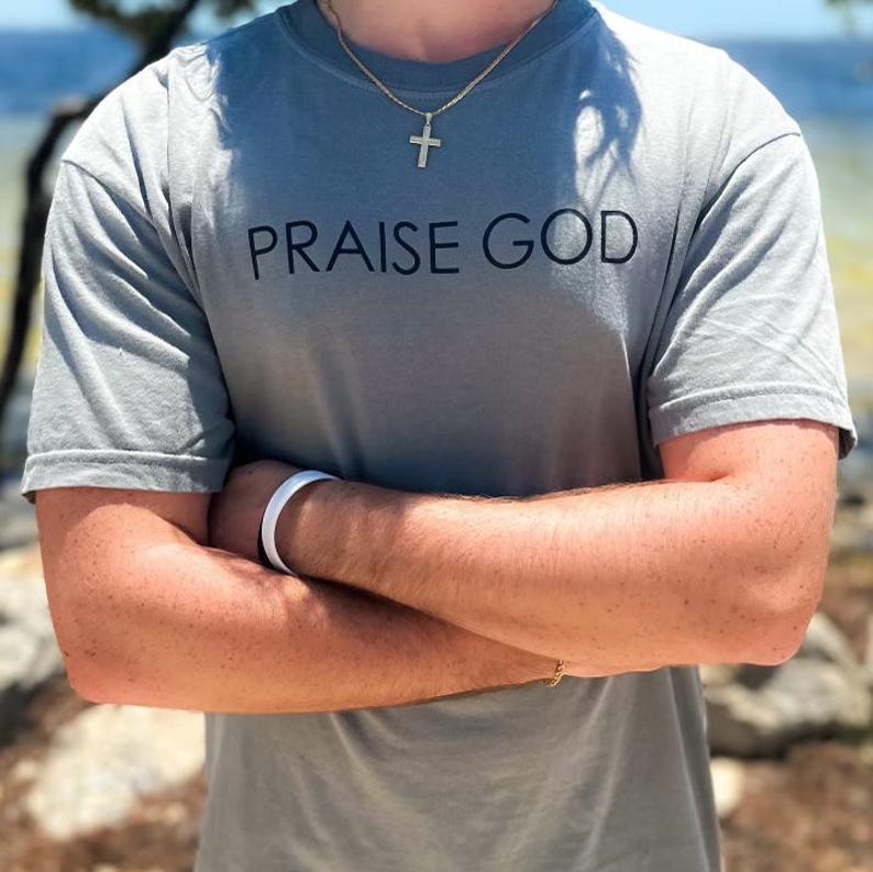 Minimalist faith based t-shirt perfect for church wear Custom Christian men’s clothing shown on male model