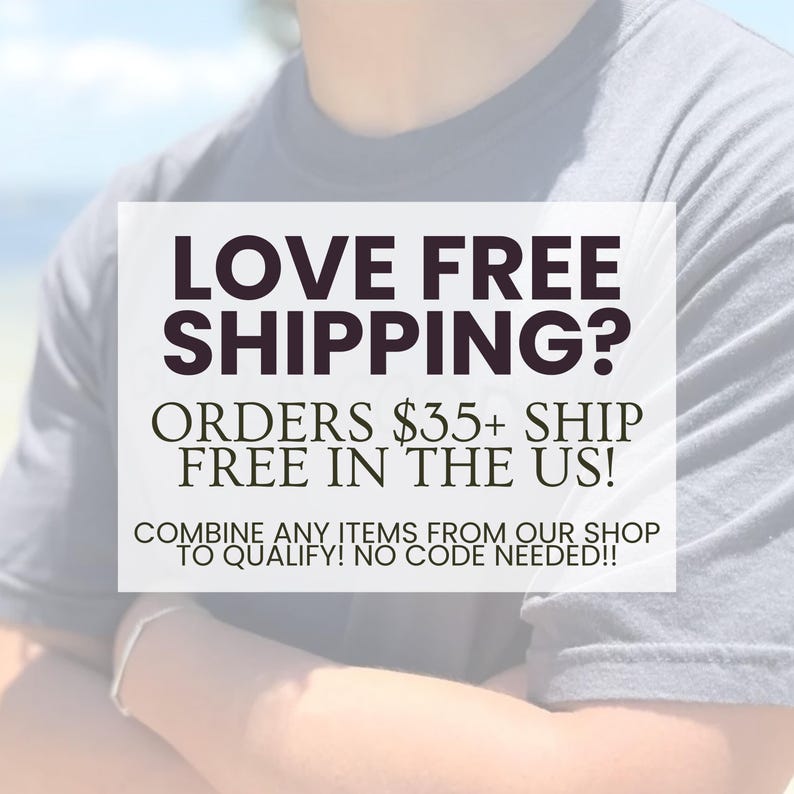 May include: A gray t-shirt with the text "LOVE FREE SHIPPING?" in a bold, dark font. Below, the text reads "ORDERS $35+ SHIP FREE IN THE US!" and "COMBINE ANY ITEMS FROM OUR SHOP TO QUALIFY! NO CODE NEEDED!!"