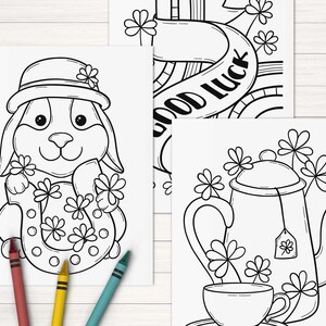 May include: Three black and white coloring pages featuring a rabbit holding a horseshoe, a teapot and teacup, and a banner with the text "Good Luck".