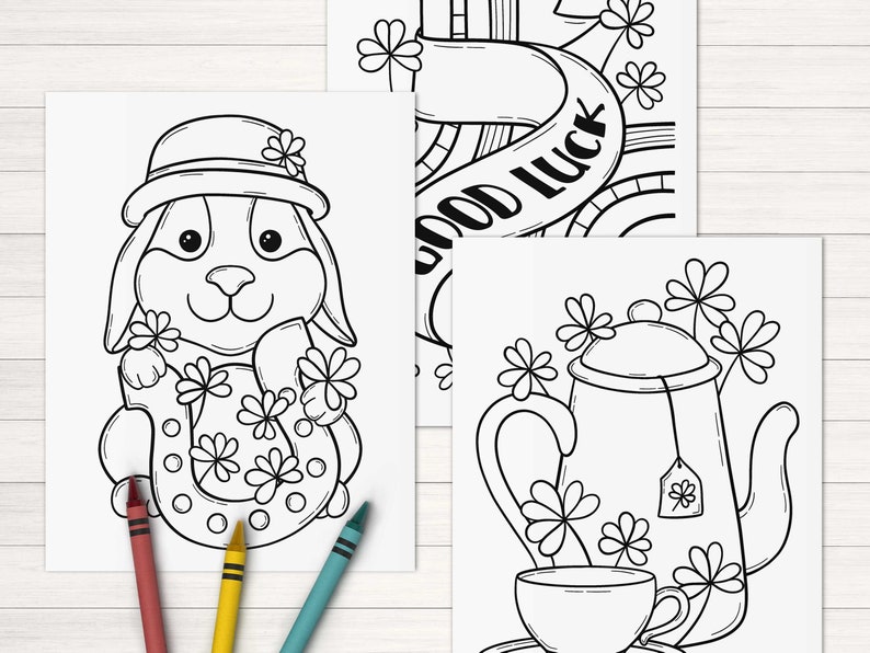 May include: Three black and white coloring pages featuring a rabbit holding a horseshoe, a teapot and teacup, and a banner with the text "Good Luck".