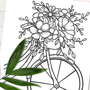 Peut inclure: Un dessin au trait noir et blanc d'un v&eacute;lo avec un panier rempli de fleurs. Le v&eacute;lo a une seule roue avant et un panier sur le guidon. Les fleurs sont en fleurs et ont des formes et des tailles vari&eacute;es.