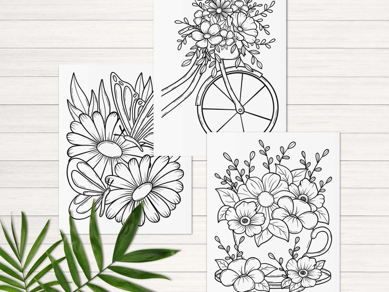 Peut inclure: Trois pages &agrave; colorier en noir et blanc repr&eacute;sentant des motifs floraux. La premi&egrave;re page montre un papillon et des fleurs. La deuxi&egrave;me page montre un v&eacute;lo avec des fleurs dans le panier. La troisi&egrave;me page montre une tasse avec des fleurs.