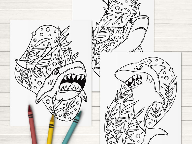 May include: Three black and white coloring pages featuring sharks swimming in a coral reef. Each page has a different shark design with detailed line art.