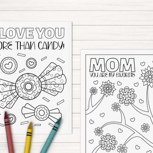 May include: Two black and white coloring pages. The first page features a candy with the text "I love you more than candy!" The second page features flowers and the text "Mom you are my favorite".