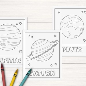 May include: Black and white printable coloring pages featuring illustrations of Jupiter, Saturn, and Pluto. Each planet has a name label and stars surrounding it.