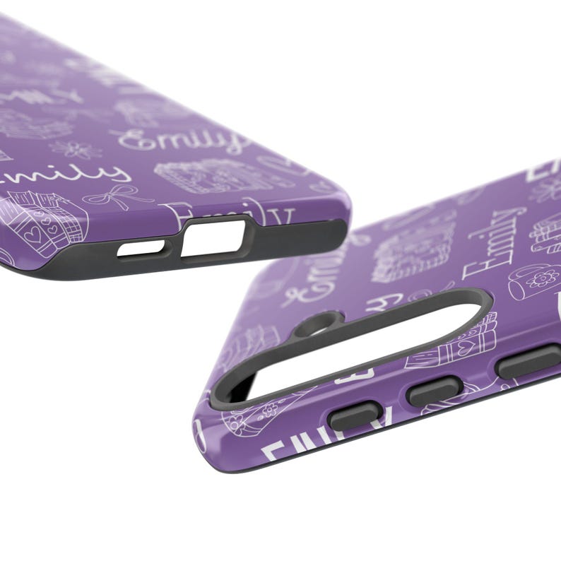 May include: Two purple phone cases with a white doodle pattern and the name "Emily" repeated. The cases have a black border and cutouts for the camera and buttons. The design includes hearts, gifts, and other small illustrations.