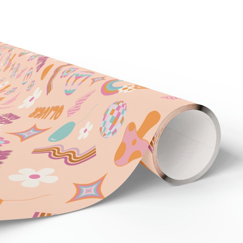 May include: Peach-colored wrapping paper with a retro-inspired pattern featuring rainbows, mushrooms, stars, and the word "OUTER" in a groovy font.