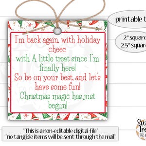 May include: A square Christmas gift tag with a red border and festive elf hat and snowflake pattern. The tag includes the text "I'm back again, with holiday cheer...Christmas magic has just begun!" and is tied with twine.