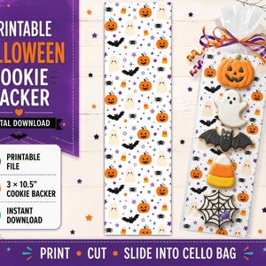 May include: A printable Halloween cookie backer digital download featuring a white background with orange pumpkins, white ghosts, black bats, spiders, and candy corn. The set includes a 7.62 x 26.67 cm backer card and a clear cellophane bag with cookies.