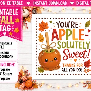 May include: A square printable fall tag featuring a cartoon caramel apple with a smiling face and a wooden stick. The text reads: YOU'RE APPLE-SOLUTELY SWEET! THANKS FOR ALL YOU DO! The design is decorated with colorful autumn leaves and a dotted border.