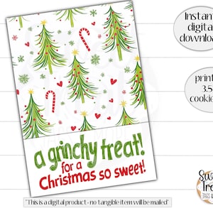 Puede incluir: Tarjeta de galletas imprimible con temática navideña, con fondo blanco adornado con árboles de Navidad verdes, corazones rojos y bastones de caramelo. La tarjeta dice "a grinchy treat! for a Christmas so sweet!" y es imprimible de 3,5x5".
