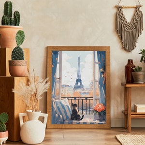 May include: A framed print of a Parisian cityscape with a cat sitting on a windowsill. The print features a view of the Eiffel Tower and a balcony with flowers. The frame is brown wood and the print is on a white background.