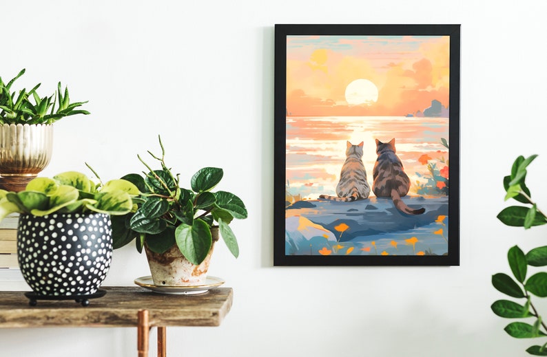 May include: A painting of two cats sitting on a rock overlooking a sunset over the ocean. The cats are facing away from the viewer, and the sunset is a vibrant orange and pink.