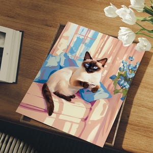 May include: A colorful illustration of a Siamese cat resting on a blue pillow. The cat has blue eyes and is holding a small cup. The background features a window and curtains, with a bouquet of white flowers and blue flowers.
