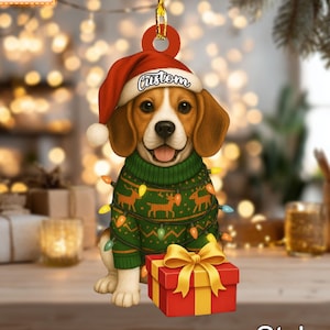 May include: A Christmas decoration depicting a beagle wearing a Santa hat and a green reindeer sweater with fairy lights. The dog is holding a red gift box with a gold bow. The word "Custom" is on the hat. The text "Name Can Be Changed" is in a blue box.