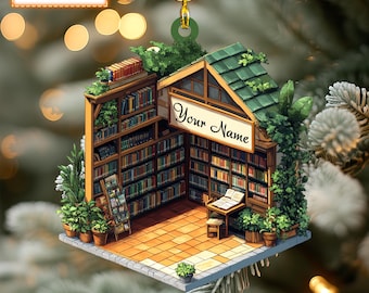 May include: A whimsical Christmas ornament shaped like a miniature bookstore with a green roof and a sign that says "Your Name". The ornament is filled with bookshelves and greenery.