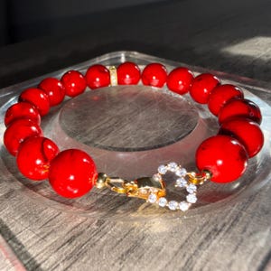 May include: A set of three ceramic mugs with a speckled, matte finish. Each mug features a different color: light blue, cream, and gray. The mugs have a simple, modern design and a comfortable handle.