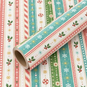 May include: A roll of wrapping paper featuring vertical stripes in red, white, and teal. The pattern includes repeating motifs of holly berries, white snowflakes, gold starbursts, red and white peppermint candies, and small white polka dots.