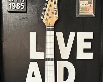 KONCERT LIVE AID Gitara ożywiona na wielkoformatowej, trójwymiarowej ścianie