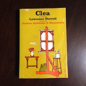 May include: A vintage paperback book titled "Clea" by Lawrence Durrell. The cover is yellow with orange and white illustrations, including a figure, a window, and a still life. The author's other works are also listed.