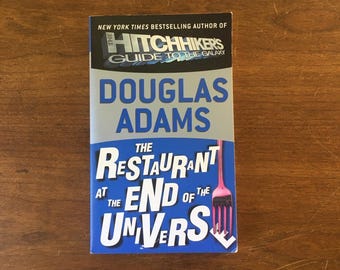 Douglas Adams “The Restaurant At The End Of The Universe”. Paperback in good condition.