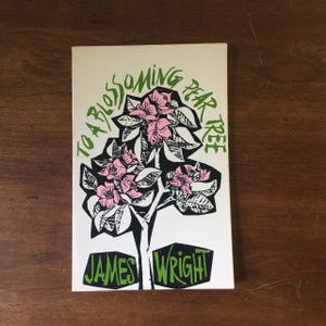 May include: A book cover with the title "TO A BLOSSOMING PEAR TREE" in green, with a black and white illustration of a pear tree with pink blossoms. The author's name, "JAMES WRIGHT," is in green at the bottom.