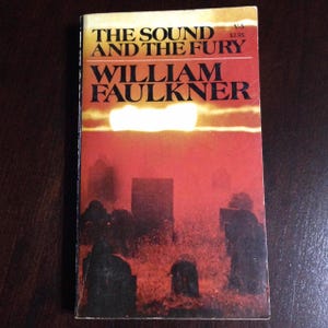 The Sound And The Fury”. William Faulkner. Vintage paperback in good condition