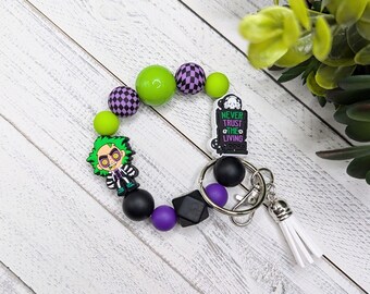 Beetle Guy Horror Wristlet With Silicone Charms Stretches 8" Key Ring Tassel