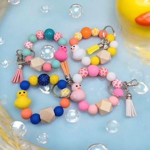 Amuleto de silicona para pulsera con forma de patitos de goma, colorido, que se estira hasta 7,5" y se puede utilizar como llavero o como borla