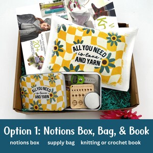 Picture shows a gift box of crochet supplies.  The crochet notions tin has a retro floral design with various crochet and knitting notions inside.  There is also a pattern book.
