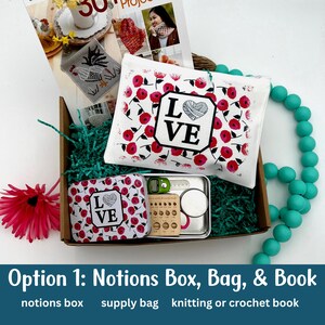 A crochet gift box with a crochet book, notions tin, and knitting supply bag.