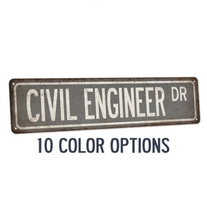 May include: Rustic metal sign with the text "CIVIL ENGINEER DR" in white lettering on a gray background. The sign has a distressed, aged look and is perfect for a home office or garage.
