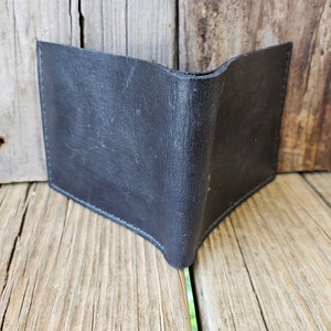 Cartera plegable clásica de piel negra