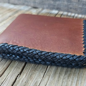 Cordón de borde, cartera de cuero.