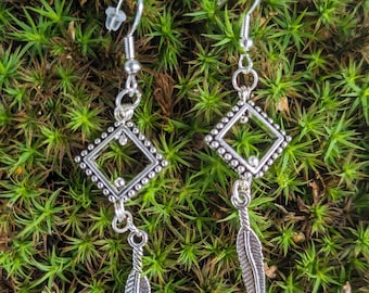 Modern geometric dangle earrings made in Finland