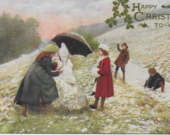 Vintage ansichtkaart, Happy Christmas to You, kinderen die een sneeuwpop bouwen, Raphael Tuck, geplaatst in 1907