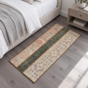 May include: A rectangular runner rug featuring a patchwork design with three distinct sections. The pattern includes muted tones of sage green, soft pink, and beige with intricate geometric and floral motifs throughout the fabric surface.