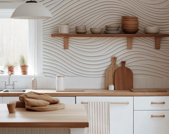 May include: A white kitchen with white cabinets and a wooden countertop. The backsplash is a white tile with a wavy pattern. There is a wooden shelf with bowls and cutting boards on it. There is a wooden island with a stool in the foreground.
