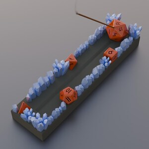 Elevate your space with this unique, 3D-printable incense holder designed for tabletop gamers and fantasy lovers alike. This STL file features an intricately detailed incense holder adorned with gaming dice and mystical crystals.