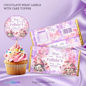 May include: A cupcake with pink frosting and sprinkles beside chocolate bar wrappers and a cake topper. The wrappers and topper feature a fairy theme with text that reads "Flutter and Swirl Felizia's Fairy First Birthday".