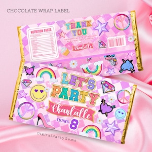 May include: A pink and purple chocolate bar wrapper with a chequered pattern. It features a rainbow, stars, peace signs, and the text "Let's Party Chanlalle Turns 8".