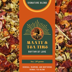 May include: A close-up of a blend of dried herbs and fruit pieces, including red berries, orange peel, and green leaves. The packaging features a green and orange label with the text "MAATI'S TEA TIME" and "RHYTHM OF LOVE". The label also states "SIGNATURE BLEND", "2oz. | 57 grams", and "SENSUAL, WARMING, AND NURTURING HERBAL TEA BLEND".