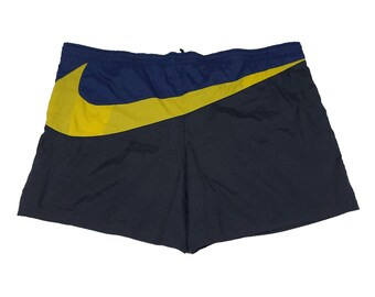 Vintage bleu Nike - Short jaune en nylon avec gros logo virgule Taille XL