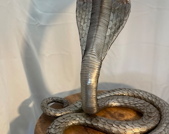 Life size metal cobra sculpture 12 foot long.