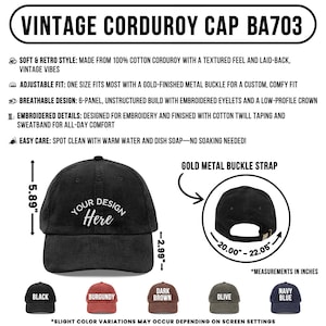 May include: Black corduroy cap with "Your Design Here" text. Features a gold metal buckle strap. The cap is 5.89 inches high and has a circumference of 20.00 to 22.05 inches. Available in black, burgundy, dark brown, olive, and navy blue.