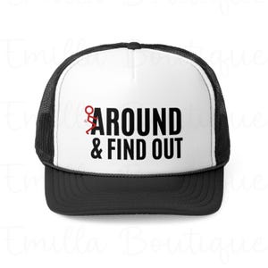 May include: A white and black trucker hat with a red stick figure and the text "AROUND & FIND OUT".